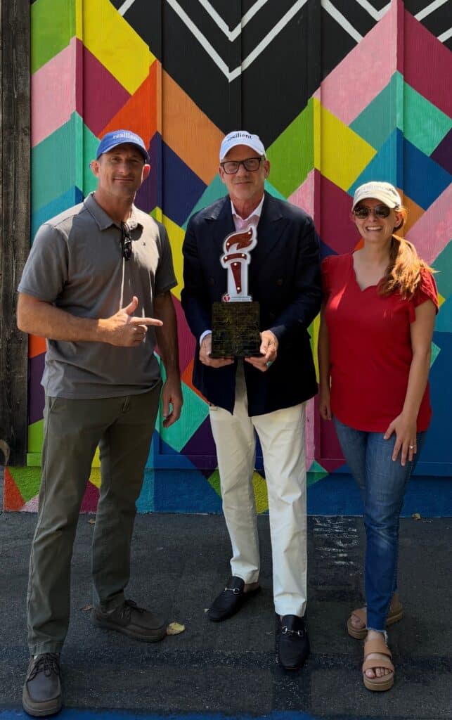 Jeff Pofsky holding the American Heart Association Torch with supporters