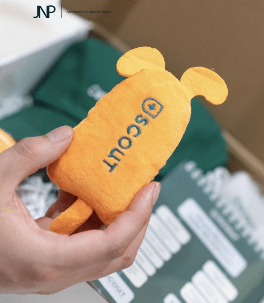 Yellow plush merchandise embroidered with the Scout logo