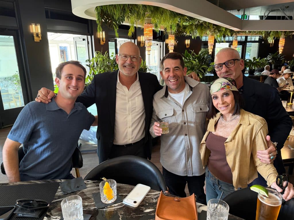 Five JNP teammates gathered inside BLVD Steak before dinner